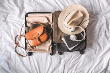 Travel. Staycation.local travel new normal.Girl traveler packing luggage in suitcase...