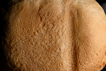 the detailed texture of the crust of freshly baked bread