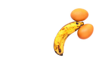 banana and two eggs representing men's penis on white background with clipping path.