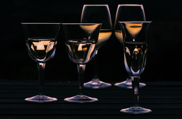 Elegant wine glasses at sunset