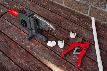 Pipes of sanitary engineering welded plastic. Ppr Pipe welding tool