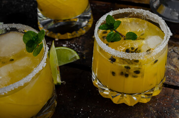 Fresh and Tropical cocktail with passion fruit, lime, mint and ice. Cold summer drink. Beverages...