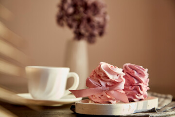 Festive dessert - berry marshmallows with currant and cup of black tea. Blurred foreground. Autumn cozy breakfast. Healthy sweets, natural food sugar and gluten free.