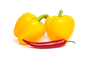 Fresh vegetables, whole yellow bell pepper (paprika) and chilli isolated on white background