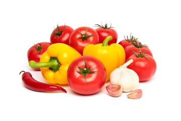 Fresh vegetables, tomato, yellow bell pepper (paprika), chilli and garlic isolated on white background