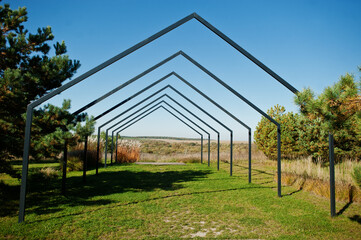 Triangular metal arch outdoor for wedding ceremonies.