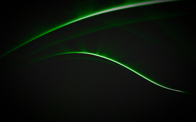 Green lines on black background. Abstract green waves