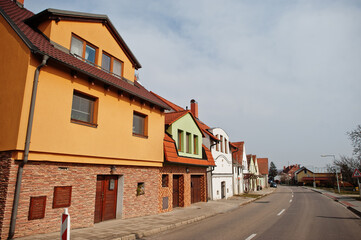 Fototapeta na wymiar Houses and street at Drnholec, South Moravia, Czech Republic.