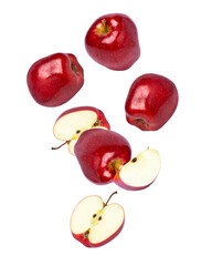 Red  apples with cut half slice flying in the air isolated on white background.