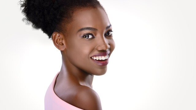 Beautiful woman . Beauty portrait of african american woman with clean healthy skin on white background.