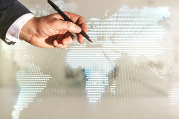 Man hand with pen working with abstract creative world map interface on blurred office background, international trading concept. Multiexposure
