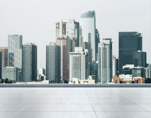 Empty concrete rooftop on the background of a beautiful Los Angeles city skyline at daytime, mockup