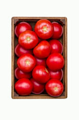 Large raw red tomatoes in a wooden box