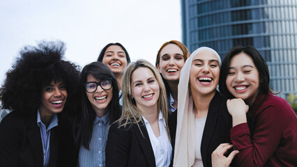 Happy business women smiling on camera outdoor with office buildings on background - Meeting and finance concept - Focus on center female face