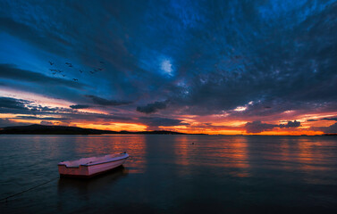 There are wonderful compositions with sunken boats at sunrise and sunset.