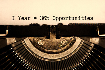 1 year 365 opportunities words typed on an old vintage typewriter in black and white