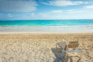 Fototapeta na wymiar Tropical paradise: Cancun caribbean with beach chair, Riviera Maya, Mexico