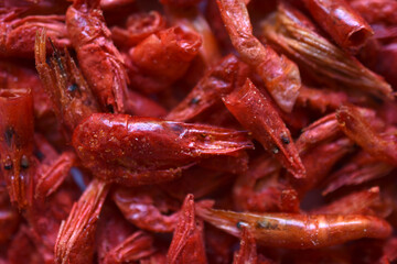 Red peppered shrimp as a background. Delicious shrimp close-up. Delicious seafood appetizer.