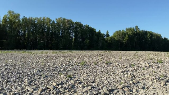 River in Drought Conditions due to global warming and climate change leaving the ground exposed. slow panning