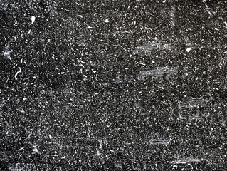 White ink droplets of paint on black background. Splatter background. Abstract dark wallpaper. Dark shabby concrete wall. stained texture. Painted backdrop.