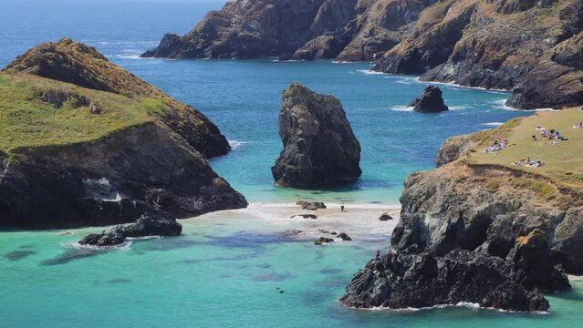 Static shot of Secluded cove and Beach with tourists, Kynance Cove, Cornwall