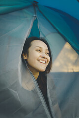 Young woman beautiful smile show her face outside the tent