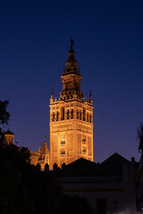 Naklejka premium Giralda of Seville Cathedral illuminated at blue hour