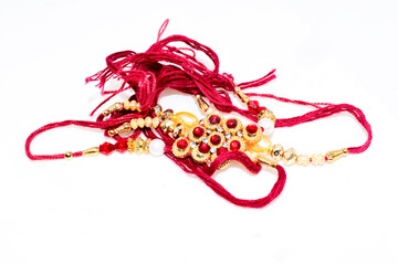 Indian festival, Raksha Bandhan background with an elegant Rakhi isolated on  white background.