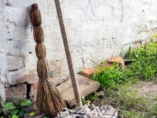 old dirty broom and mop outside