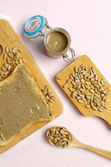 Organic toast bread with healthy organic sunflower seed butter close up. Vertical photo