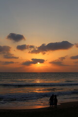 Fototapeta premium The sun sets below the horizon on the Mediterranean Sea in northern Israel.