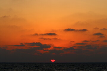 The sun sets below the horizon on the Mediterranean Sea in northern Israel.