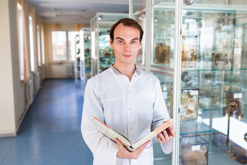 A student of the medical university in the anatomical museum. A future nurse in the office of a nursing school.