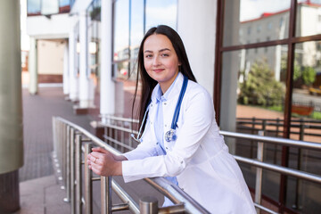 Portrait of a medical student on the threshold of a university clinic. The concept of modern...