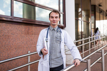 Portrait of a medical student on the threshold of a university clinic. The concept of modern...