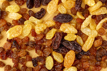 Different types of dried raisins close-up. Snacks from dried fruits. Selective focus. Close up