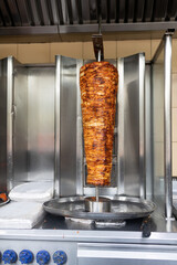 Stacked Chicken roasting  preparation of traditional Turkish  doner and shawarma in Dubai United Arab  Emirates 