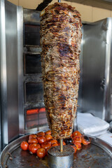 Stacked meat roasting  preparation of traditional Turkish  doner and shawarma in Dubai United Arab  Emirates 
