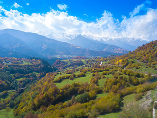 Fototapeta na wymiar Beautiful drone views of the autumn mountains in Svaneti on a sunny day. Beautiful autumn mountain landscape from a drone.