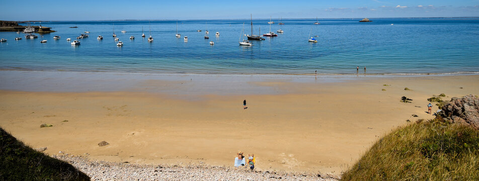 &Icirc;le d'Houat, Gulf of Morbihan, wide angle, ladies in hats on beach towel, sea bathing, bathers, sand and pebbles  moored sailboats, perfect framing, perfect perspective, palette of blues, skyline, 