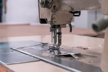 Old sewing machine in the workshop