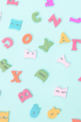 Multicolored letters on a blue background.