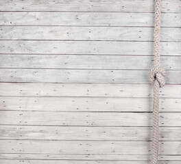 white wooden wall with nautical rope