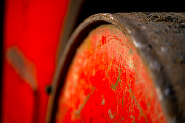 Rusty and dirty metal surface with old red paint.
