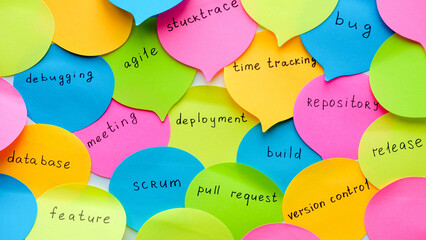 Multi-colored bubble stickers with terms from the IT field - release, bug, meeting, feature, database, agile