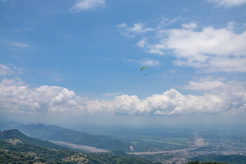 Fototapeta na wymiar Paragliding from the mountains of villaviencio in Colombia