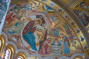 Fototapeta na wymiar Interior photographs allowed because artwork is formed from tiny colored pieces of glass. No paintings. This artwork is above looking at the ceiling at St Sava Orthodox Christian Church or Temple.