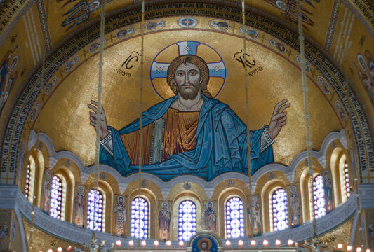 Interior photographs allowed because artwork is formed from tiny colored pieces of glass. No paintings. This artwork is above looking at the ceiling at St Sava Orthodox Christian Church or Temple.