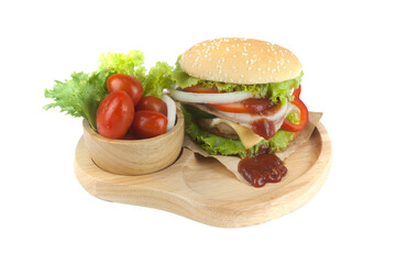 Pork hamburger Homemade with grilled bacon contains vegetables, cheese, lettuce, onion, chilli, spices in a wooden dish isolated on white backgroud