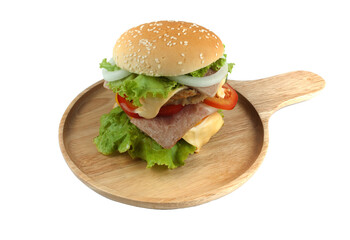 Pork hamburger Homemade with grilled bacon contains vegetables, cheese, lettuce, onion, chilli, spices in a wooden dish isolated on white backgroud
